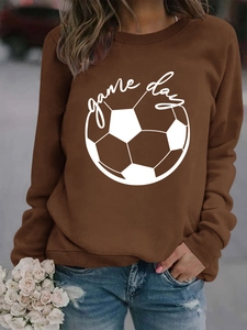 Close-up of ribbed crewneck and Game Day football graphic on brown oversized sweatshirt