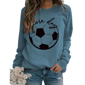 Close-up of foggy blue sweatshirt fabric with Game Day text and football print details