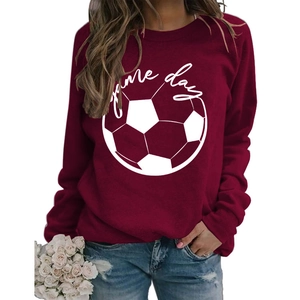 Detail of burgundy sweatshirt featuring a white football graphic and Game Day text print