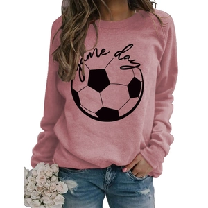 Detail of pink crewneck sweatshirt featuring black Game Day print and football graphic