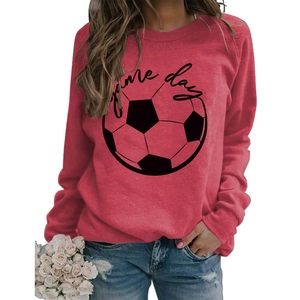 Detail of red crewneck sweatshirt featuring black Game Day text and football graphic