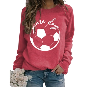 Detail of red crewneck sweatshirt featuring white Game Day print and soccer graphic