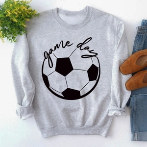 Close-up of gray sweatshirt with football graphic and game day print on white background