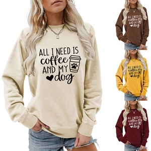 Detail view of round neck sweatshirts in four colors with ALL I NEED dog and coffee print