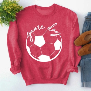 Detail of red crewneck sweatshirt with white Game Day graphic and football print