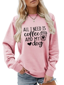 Detail of pink crewneck sweatshirt with 'ALL I NEED' coffee and dog print