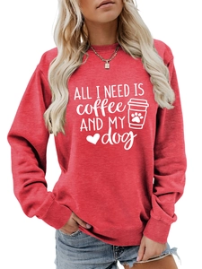 Close-up of All I Need Is Coffee and My Dog print on a red crewneck sweatshirt