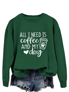 Detail of ALL I NEED coffee and dog print on dark green crewneck sweatshirt fabric