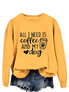 Detail of loose-fit mustard yellow sweatshirt with coffee and dog print design