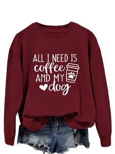 Detail of the 'All I Need' print on this burgundy crew neck long sleeve sweatshirt