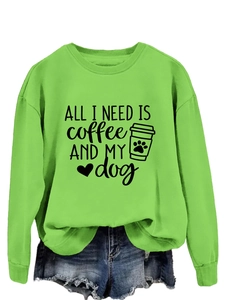Detail of neon green crewneck sweatshirt with ALL I NEED IS coffee AND MY dog print