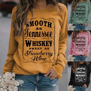 Detail view of various crewneck sweatshirts featuring vintage Tennessee Whiskey prints