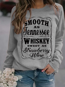 Detail of grey crewneck sweatshirt with vintage Tennessee whiskey letter print