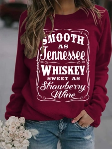 Detail of burgundy sweatshirt with Smooth as Tennessee Whiskey vintage white text