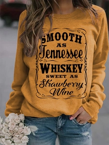 Close-up of Smooth as Tennessee Whiskey print on mustard yellow crewneck sweatshirt