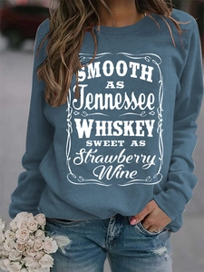 Detail of navy blue crewneck sweatshirt with Tennessee Whiskey vintage graphic print