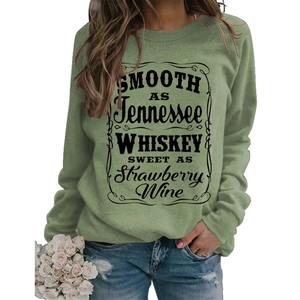 Detail of sage green crewneck sweatshirt featuring vintage black letter print