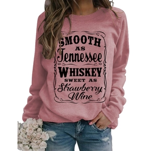 Detail of Tennessee Whiskey lettering on women's crewneck dusty rose sweatshirt