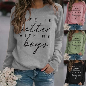 Detail of crewneck sweatshirt showing gray, pink, green and black color options