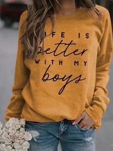 Detail of LIFE IS BETTER WITH MY BOYS text on yellow round neck sweatshirt