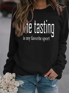 Detail view of Wine Tasting is my favorite sport print on a black crewneck sweatshirt