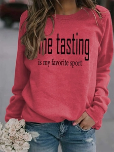 Close-up of red crew neck sweatshirt featuring Wine Tasting print with ribbed cuffs