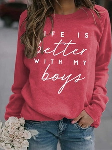 Detail of red crewneck sweatshirt featuring white Life is Better with My Boys print