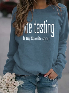 Detail of Wine Tasting slogan print on casual crewneck sweatshirt with relaxed fit