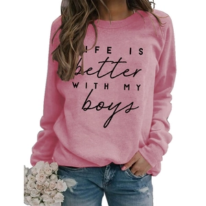Detailed close-up of pink crewneck sweatshirt with Life Is Better With My Boys print