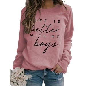 Close-up of LIFE IS BETTER WITH MY BOYS print on pink long sleeve sweatshirt