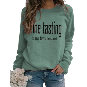 Detail view of sage green sweatshirt with Wine Tasting is my favorite sport print