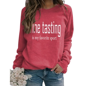 Detail of red crewneck sweatshirt with Wine Tasting Is My Favorite Sport white lettering