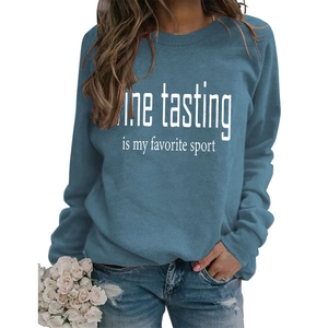 Close-up of Wine Tasting Is My Favorite Sport print on blue crewneck sweatshirt