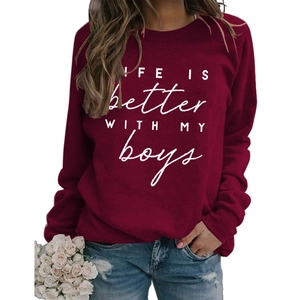 Detail of burgundy crewneck sweatshirt featuring LIFE IS BETTER printed slogan