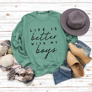 Detailed view of LIFE IS better WITH MY boys print on green crewneck sweatshirt