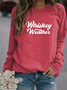 Detail of red Whiskey Weather sweatshirt showing long sleeves and white lettering print