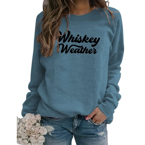 Detail of Whiskey Weather printed blue-grey sweatshirt paired with ripped denim jeans