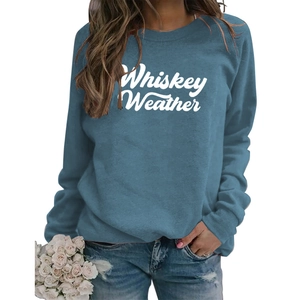Detail of Whiskey Weather white letter printing on soft navy blue crewneck sweatshirt
