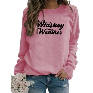 Detail of Whiskey Weather graphic print on a pink crewneck long sleeve sweatshirt