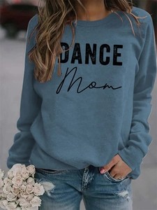 Close-up of DANCE MOM lettering on blue long-sleeve crewneck sweatshirt with flowers
