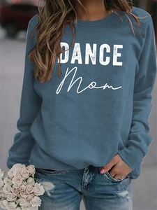 Close-up of DANCE MOM lettering on a relaxed blue-grey crewneck sweatshirt fabric