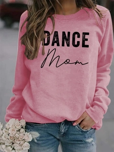 Detailed view of pink Dance Mom sweatshirt with black print on premium fabric