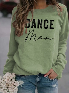 Detail of sage green crewneck sweatshirt featuring DANCE MOM print and casual fit