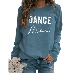 Detail of the white DANCE MOM printed text on a blue long-sleeve crewneck sweatshirt