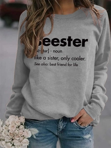 Detail of grey crewneck sweatshirt featuring a black Seester dictionary print design