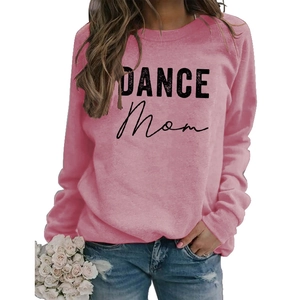 Close-up of DANCE MOM printed lettering on pink crewneck sweatshirt with ribbed cuffs