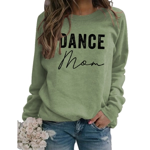 Close-up of DANCE MOM lettering and crew neck detail on grass green sweatshirt