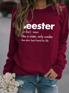 Detail of burgundy crewneck sweatshirt with Seester letter print and ribbed cuffs
