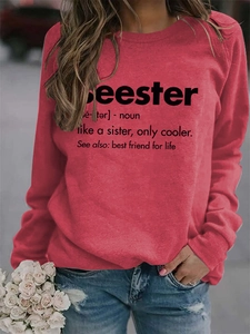 Detailed view of red crewneck sweatshirt featuring black Seester print and typography