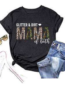 Flat lay of black T-shirt with GLITTER DIRT print styled with sunglasses and denim shorts